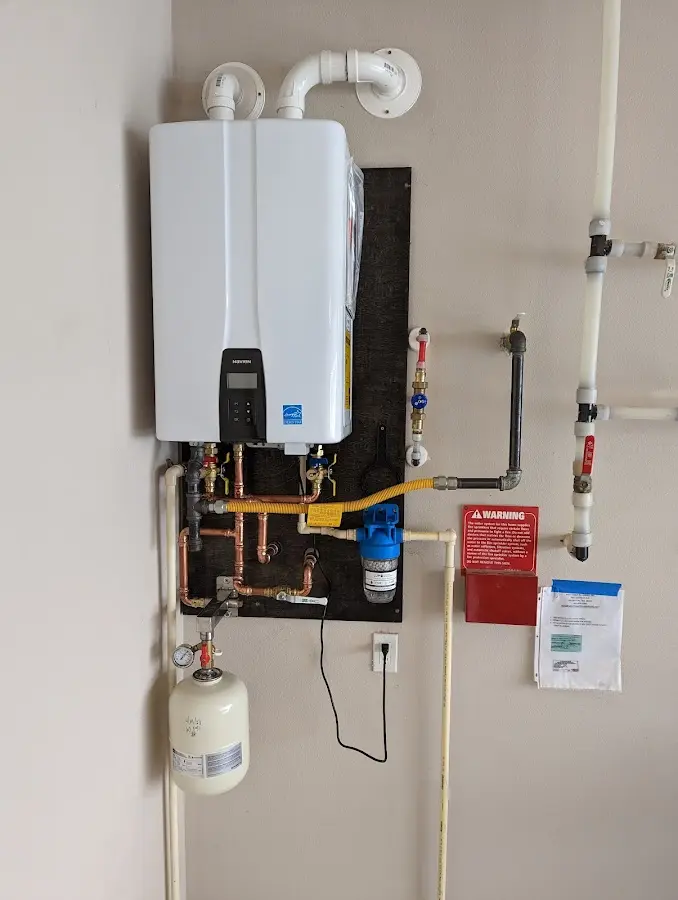 Professional plumber installing copper piping in a Shoreview home